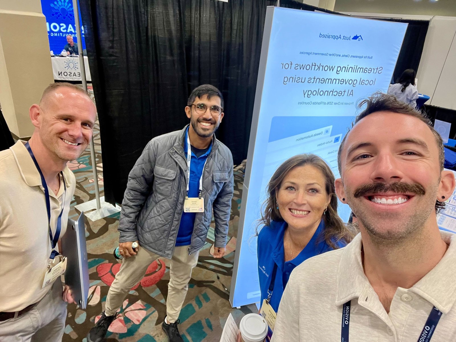 Alltus teammates at a conference booth